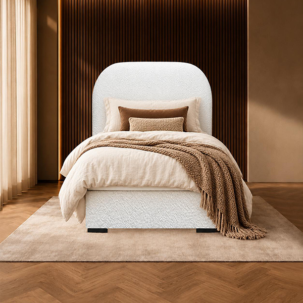 Boxspring Bouncle 1-Persoons in een lichte uitvoering met een afgerond hoofdbord